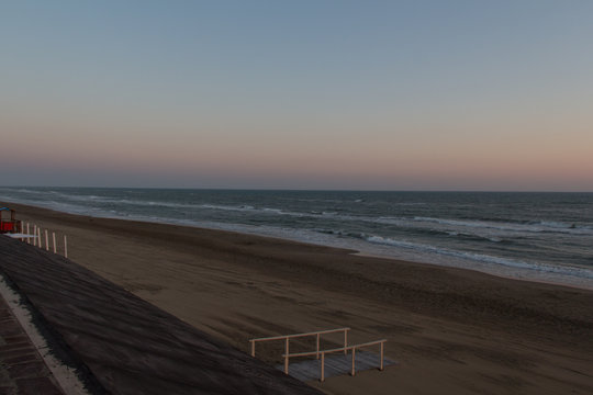 Beautiful sunset on a beach. Twilight on Tyrrhenian sea.