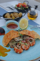Fish and Shellfish Mixed Grill. Nicely served Mediterranean seafood dish on the restaurant table.