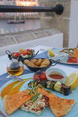 Nicely arranged colorful dinner with side dishes in the Mediterranean restaurant