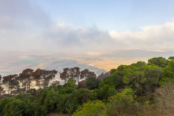 Fototapeta na wymiar Morning view at morning sunrice from Mount Tavor on a nearby valley near Nazareth in Israel