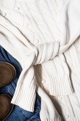 Set of women's autumn, winter clothes - jeans, white pullover oversize, suede brown boots. Fashionable clothes for walks, flat lay