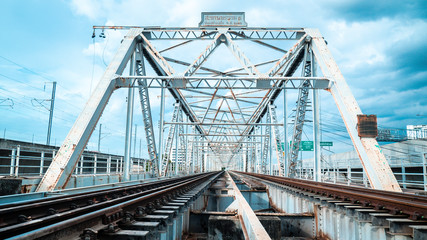 Train trestle bridge over river . the railway bridge of iron.