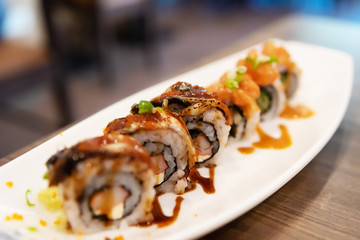 Sushi rolls japanese delicacy. Japanese traditional food from rice and fish. Beautiful serving of food . A set of delicious delicacies.