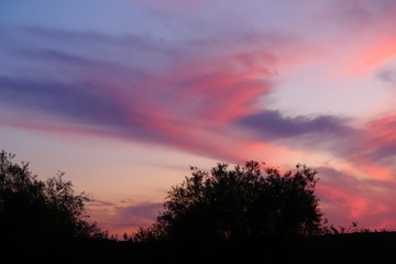 Fototapeta na wymiar Tragic dark red clouds at sunset.