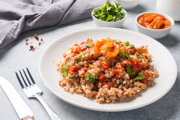 Buckwheat porridge with canned tomato and pepper.