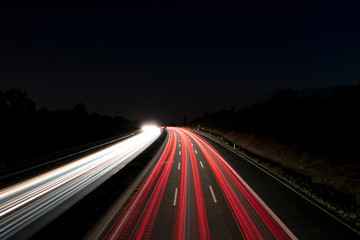Fototapeta na wymiar German freeway with car lights at night 