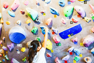 Young girl and landscape of bouldering climbing studio in Japan