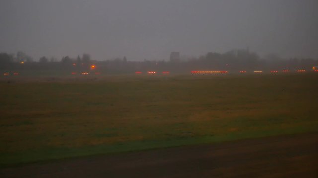 Airplane moves to the takeoff strip at the Brussels South Charleroi Airport in the early dark morning.