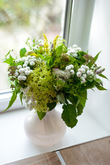 the most beautiful flowers, magnificent bouquets of flowers on the leg in the interior of the restaurant for a festive floristry store or wedding salon for the bride or groom, a bridal bouquet, butane