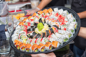 Huge sushi platter during a dinner gathering freshly prepared