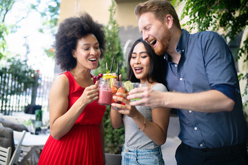 Multiracial group of friends having fun and talking