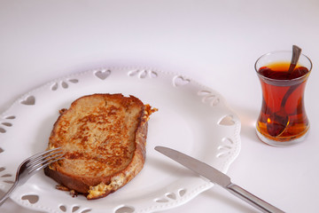 egg toast on white porcelain plate with heart (fried in hot oil)