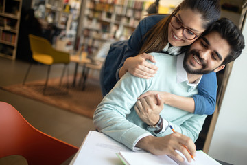 Group of young students are studying together in university