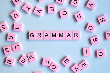 Grammar word wooden cubes on a white background