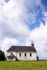 Fototapeta na wymiar Classicist Church of Holy Trinity from 1783 in Maly Haj, Hora Svate Kateriny town, Most district, Usti nad Labem region, Krusne hory, Czech Republic