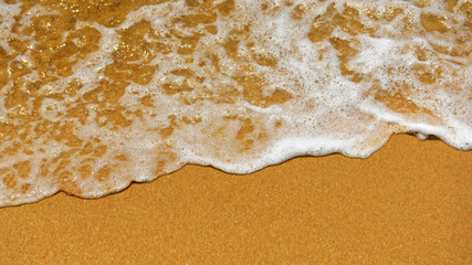 Soft wave on sandy beach texture background, happy summer holiday concept