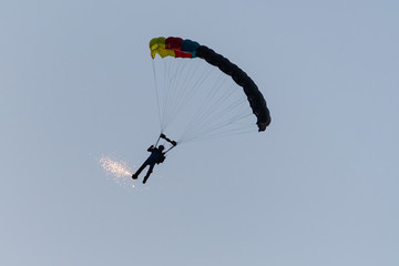 A Parachutist Executing Beautiful Aerobatic Moves at Descent