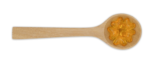 Top view vitamin pills and oil filled capsules (soft gel) in wooden spoon isolated on white background, Dietary supplement healthcare product Clipping part.