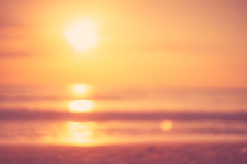 Copy space of soft sand sea and blur tropical beach with sunset sky and cloud abstract background.