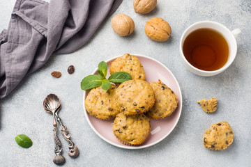 Oatmeal vegetarian muffins with blueberries and nuts on a plate. Concept healthy Breakfast.