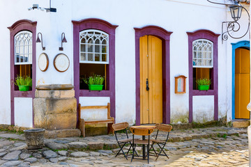 Cozy street with tables of cafe in historical center in Paraty, Rio de Janeiro, Brazil. Paraty is a preserved Portuguese colonial and Brazilian Imperial municipality