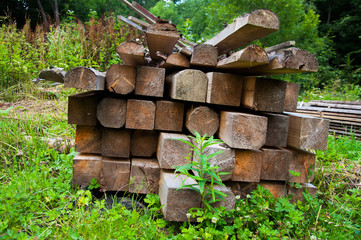 A slice or butt of thick wooden boards piled in a pile. Wood texture