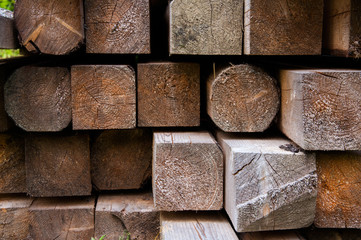 A slice or butt of thick wooden boards piled in a pile. Wood texture