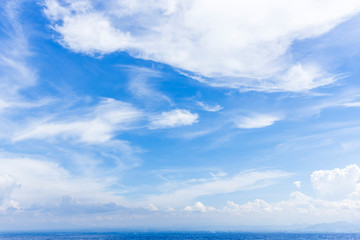 Obraz premium sky blue ocean water and blue sky with close up white fluffy tiny clouds background and pattern