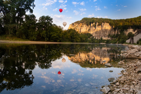 Hot air balloons at Roque Gageac, Dordogne, France. The Perigord region is famous for food and beautiful landscapes, and is a popular tourist destination.