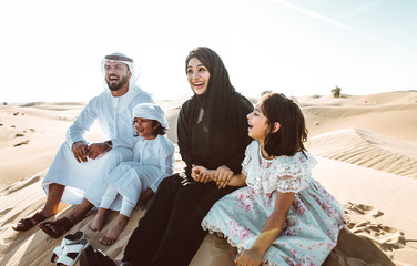 Arabian family spending a weekend in the desert, in Dubai
