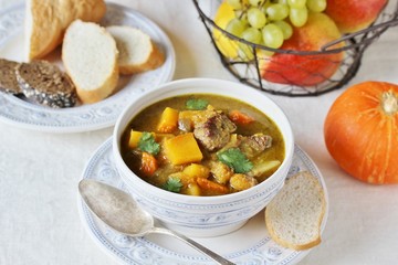 thick soup with pumpkin and beef. hearty autumn dish