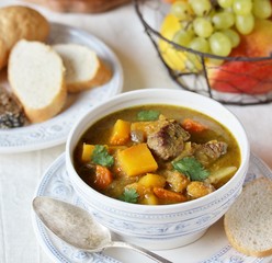 thick soup with pumpkin and beef. hearty autumn dish