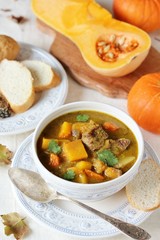 thick soup with pumpkin and beef. hearty autumn dish