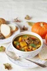 thick soup with pumpkin and beef. hearty autumn dish