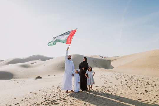 Arabian family spending a weekend in the desert, in Dubai