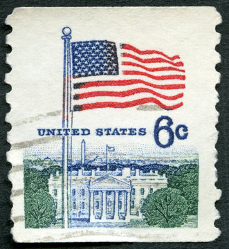 USA - 1967: shows an American Flag flying in the breeze over White House, Flag Issue