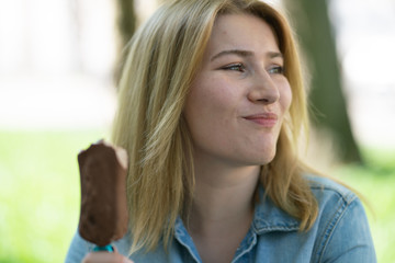 Girl eating ice cream and enjoy the summer outdoor