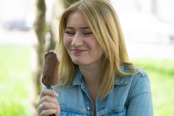 Girl eating ice cream and enjoy the summer outdoor