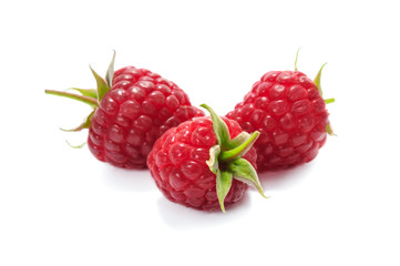 Ripe and juicy raspberries isolated on a white background in close-up