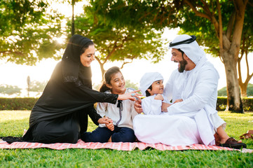 Arabian family spending time in a park