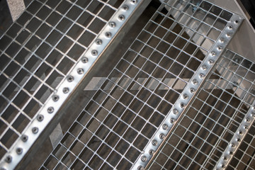 Obraz premium A metal floor and stairs are located in a factory hall.
