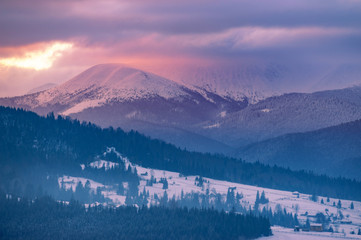 winter landscape. mountains on horizon  covered with snow