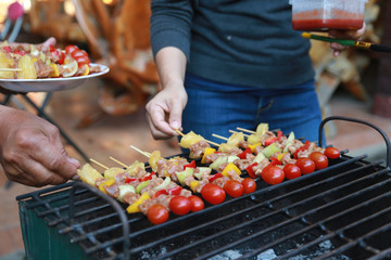 Barbeque Grill Street Food in thailand,Eat outdoors in a happy family.