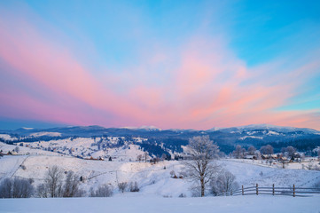 winter landscape. mountains on horizon  covered with snow