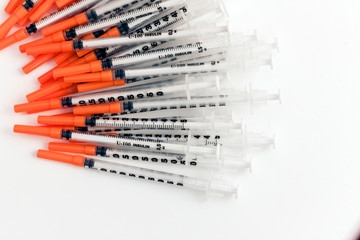 Pile of medical syringes for insulin for diabetes .