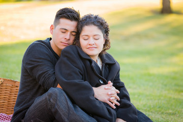 Hispanic Pregnant Young Couple Portrait Outdoors