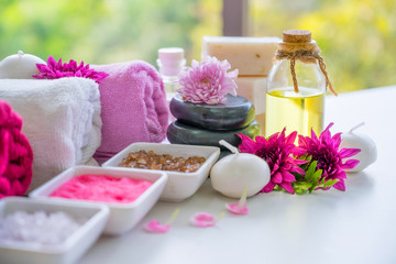 Beautiful spa composition with burning candles and towels on table