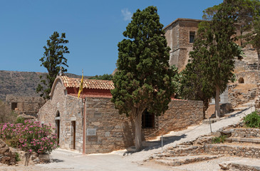 Fototapeta na wymiar Spinalonga island, Crete, Greece. June 2019. The Church of Panteleimon circa 1709 on the former Leper Colony, Spinalonga situated in the Gulf of Mirabello.