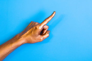 Human hands painted in gold color