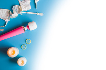 Pink vibrator on blue background